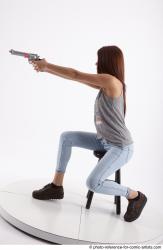 MOLLY SITTING POSE WITH GUN